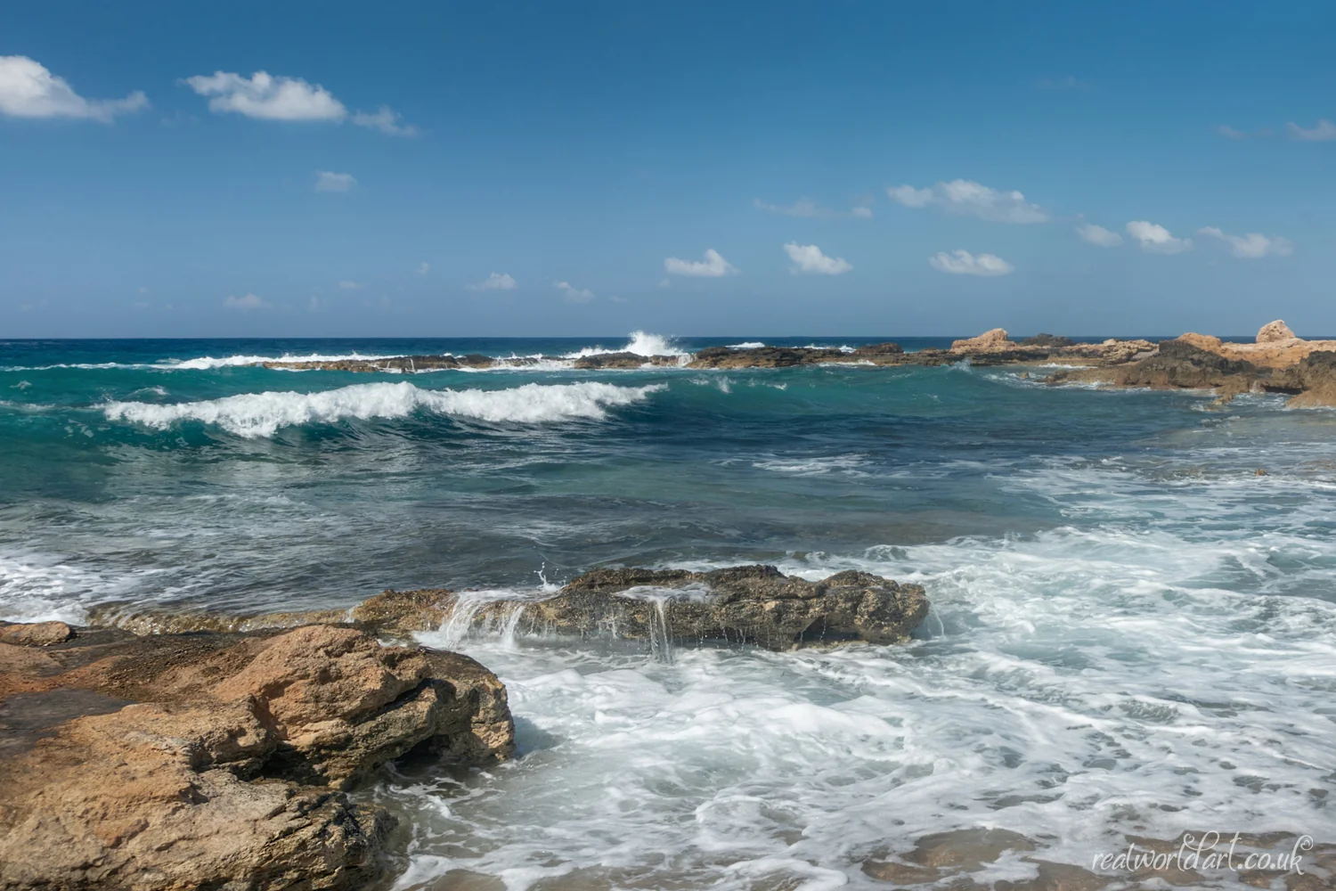 Greeting Cards: Turquoise waves breaking over flat rocks and sand taken at Agios Georgios Beach, Agios Georgios, Cyprus 