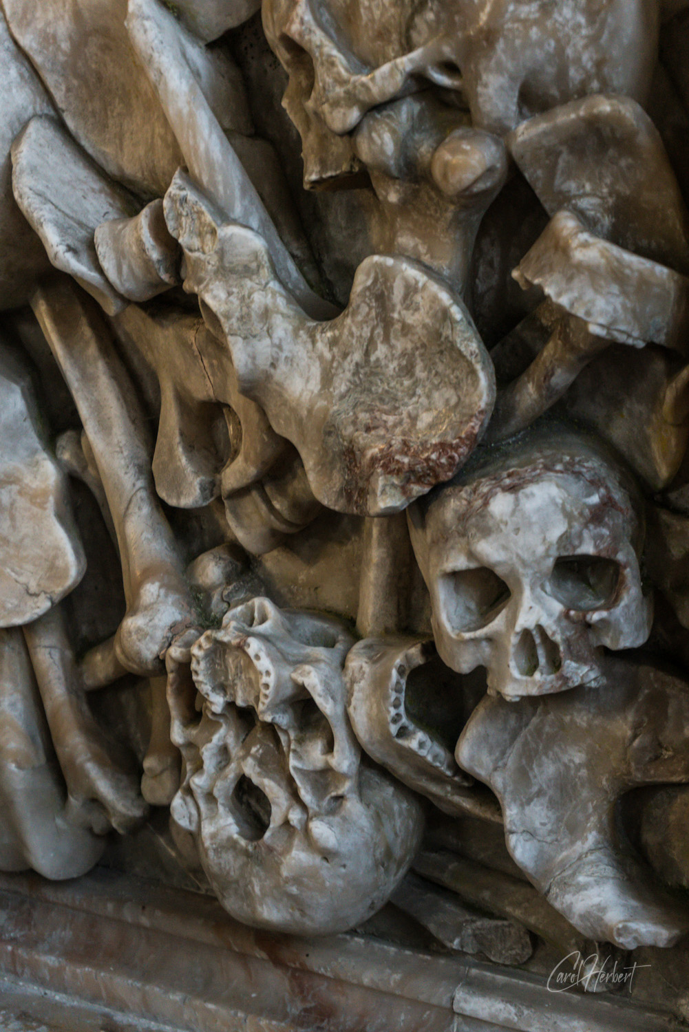 Photograph of skulls carved in marble